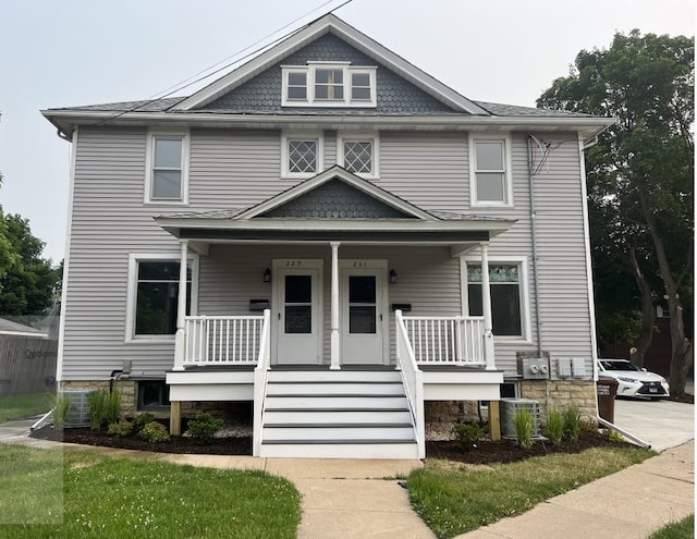 view of front of home with central AC and covered porch