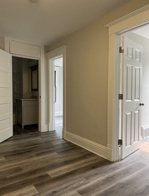 hallway featuring dark hardwood / wood-style floors