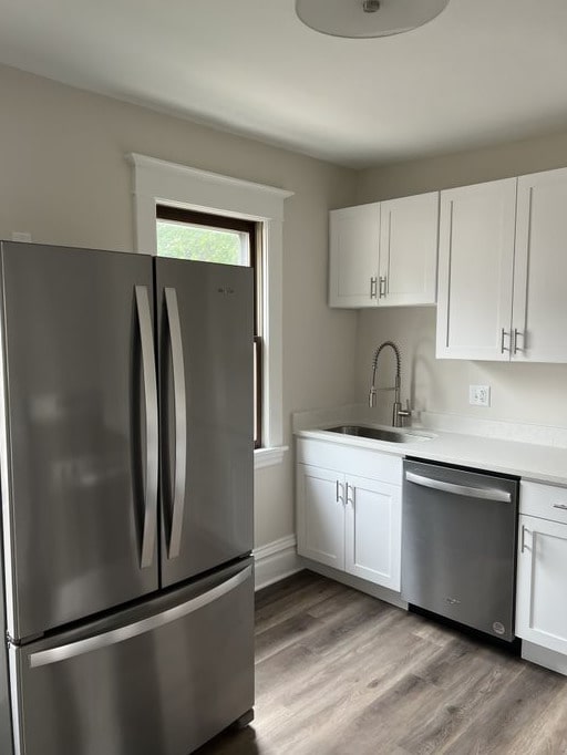 kitchen featuring white cabinets, sink, and stainless steel appliances