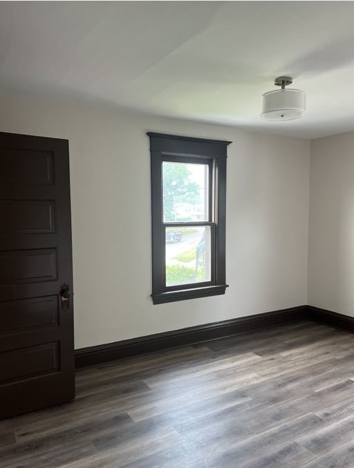 spare room featuring hardwood / wood-style floors