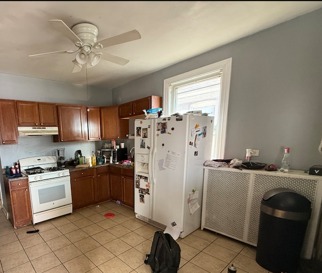 kitchen featuring white appliances, ceiling fan, and light tile patterned flooring