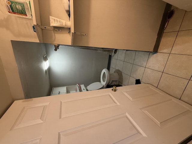 washroom featuring tile patterned floors and tile walls