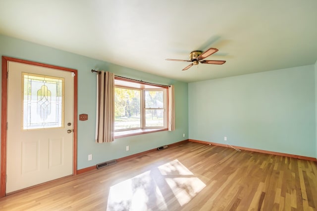 foyer entrance featuring ceiling fan and light hardwood / wood-style flooring