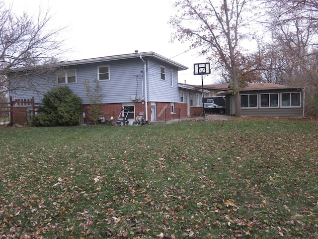 back of house with a yard