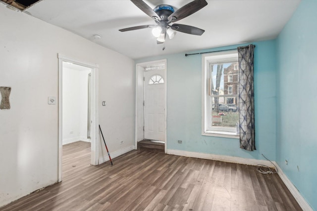 interior space with dark hardwood / wood-style floors and ceiling fan