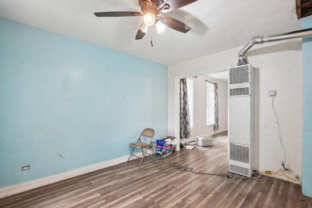 empty room featuring hardwood / wood-style flooring and ceiling fan