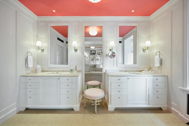 bathroom with vanity and crown molding