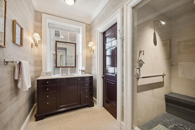 bathroom featuring a shower with door, vanity, and ornamental molding