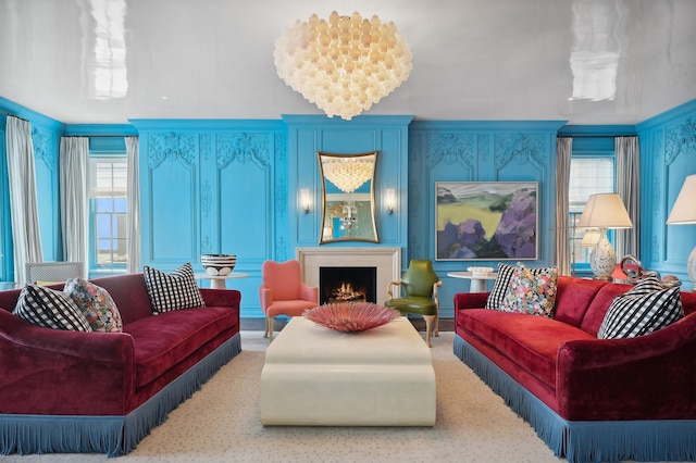 carpeted living room with a chandelier and crown molding