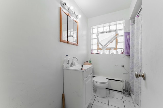 bathroom featuring toilet, vanity, tile patterned floors, and a baseboard heating unit