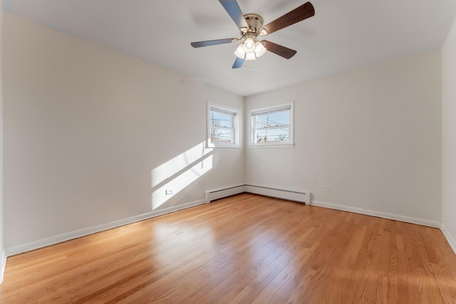 unfurnished room with baseboard heating, ceiling fan, and light hardwood / wood-style flooring