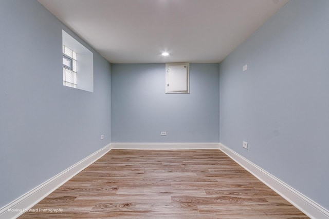 basement featuring light wood-type flooring