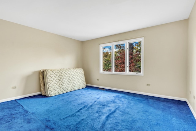 unfurnished room featuring carpet