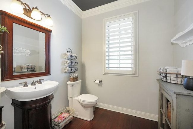 bathroom featuring hardwood / wood-style flooring, toilet, vanity, and ornamental molding