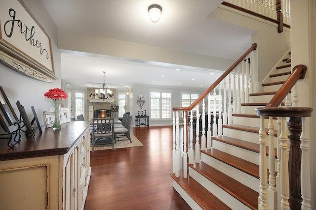 interior space with a notable chandelier and dark hardwood / wood-style floors