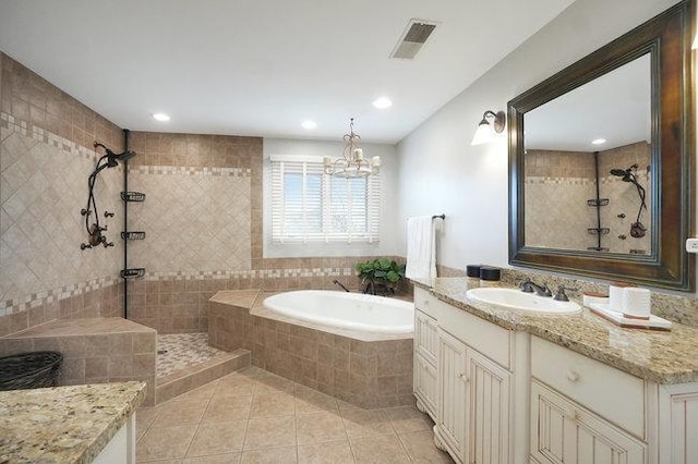 bathroom featuring tile patterned flooring, vanity, plus walk in shower, and a notable chandelier