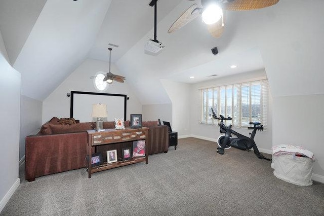 interior space featuring ceiling fan, carpet floors, and lofted ceiling