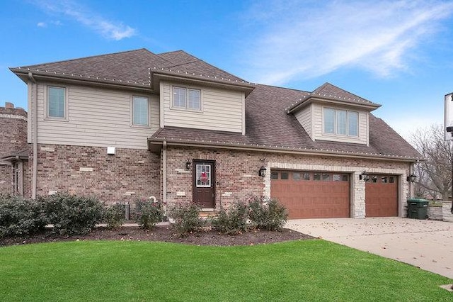 view of front of home featuring a front lawn and a garage