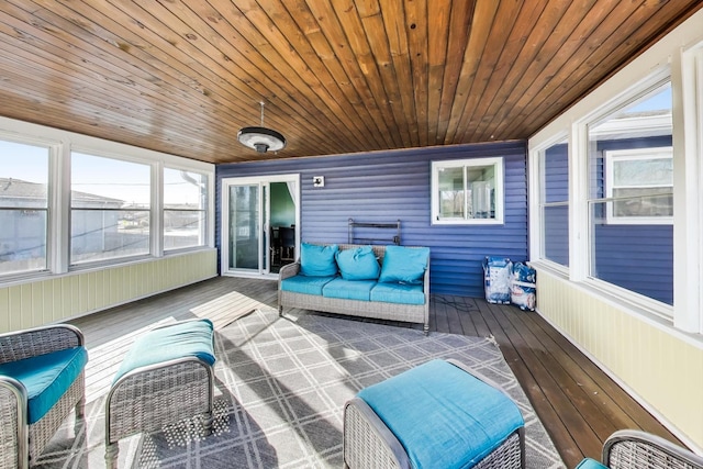 unfurnished sunroom with wooden ceiling