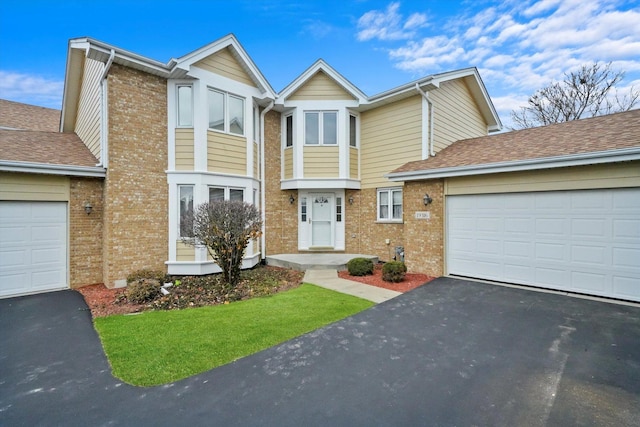 townhome / multi-family property featuring a garage