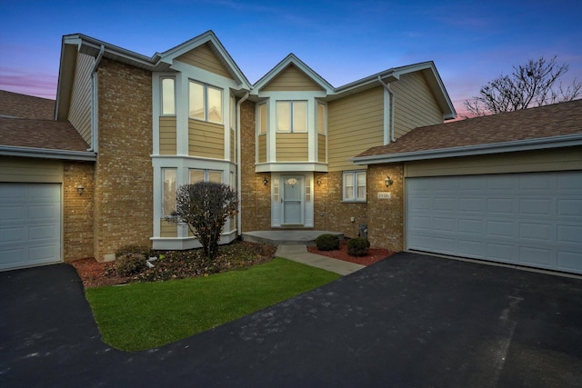 townhome / multi-family property featuring a garage