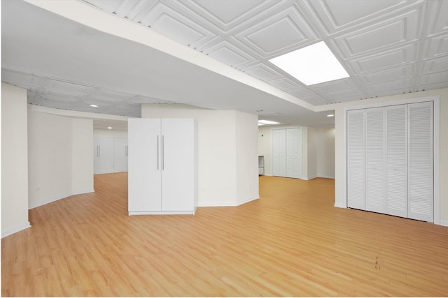 basement featuring light wood-type flooring