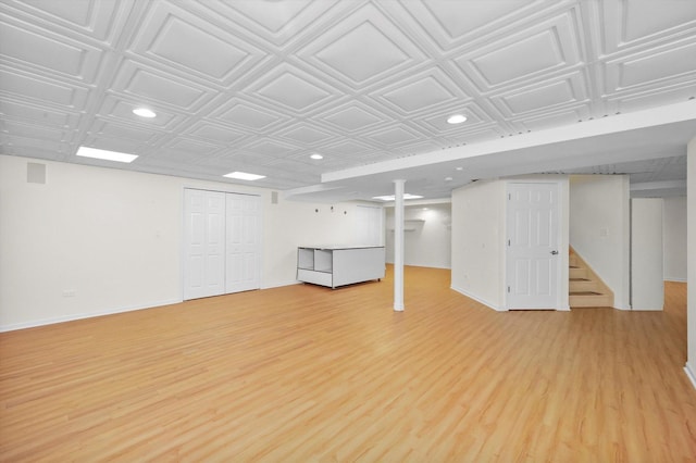 basement featuring light hardwood / wood-style flooring