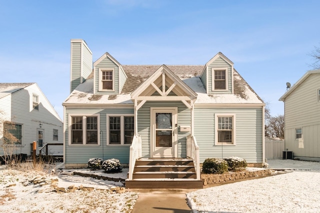 cape cod-style house featuring central air condition unit