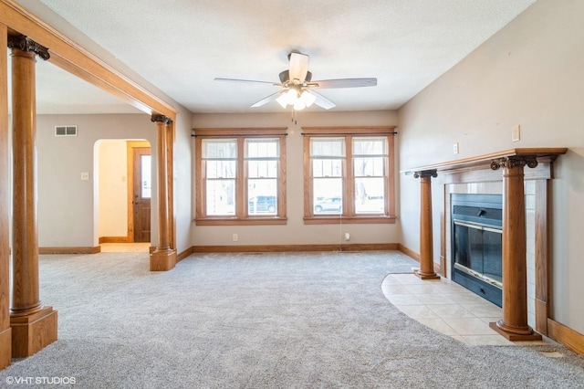 unfurnished living room with ceiling fan, light colored carpet, and a textured ceiling