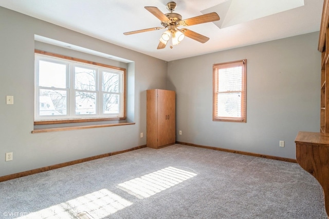 unfurnished bedroom featuring light colored carpet and ceiling fan