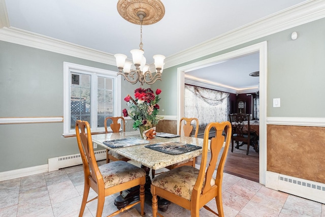 dining space featuring a baseboard radiator, an inviting chandelier, and ornamental molding