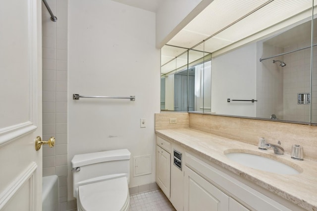 bathroom with tile patterned flooring, vanity, and toilet