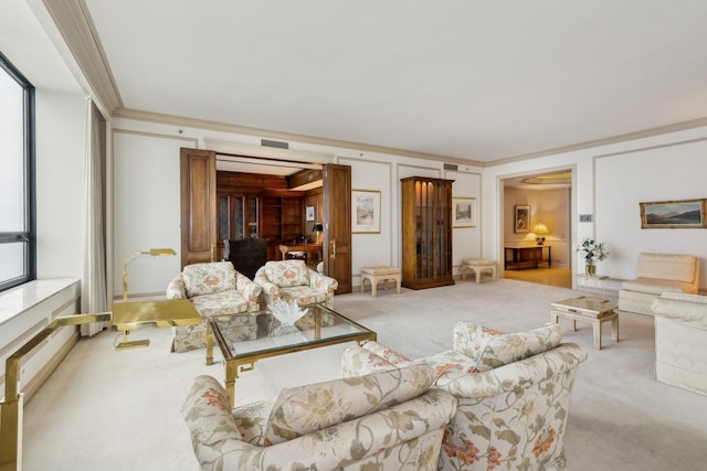 living room with light carpet, a healthy amount of sunlight, and ornamental molding