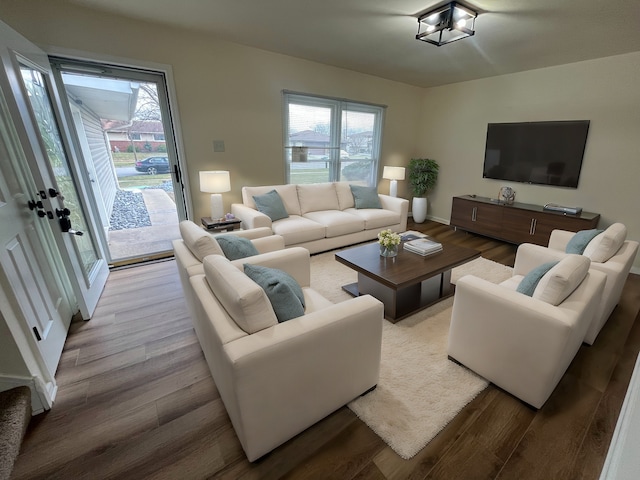 living room with light wood-type flooring and a wealth of natural light