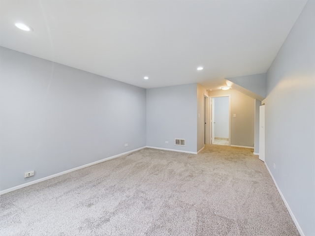 empty room featuring light colored carpet