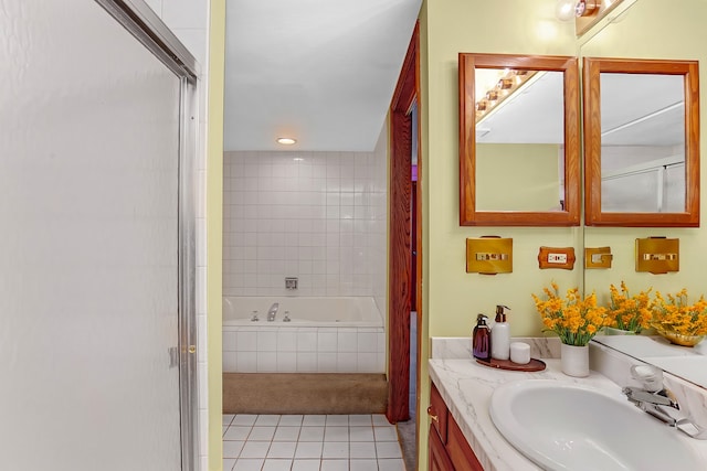 bathroom with tile patterned floors, vanity, and shower with separate bathtub