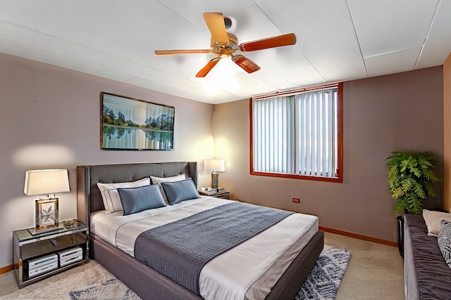 bedroom featuring ceiling fan and light colored carpet