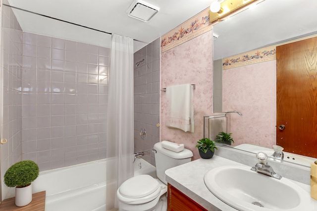 full bathroom featuring vanity, toilet, and shower / tub combo with curtain