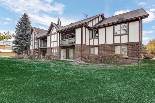 rear view of house with a lawn