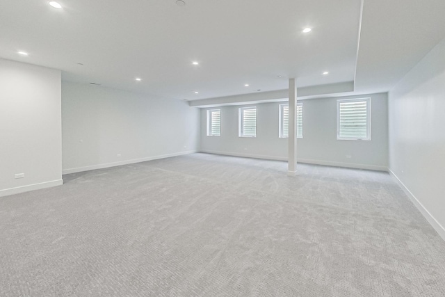 unfurnished room with recessed lighting and baseboards