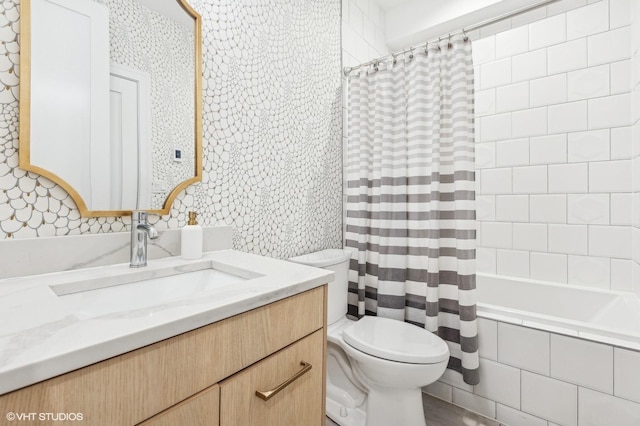 full bathroom with vanity, toilet, and shower / bath combo with shower curtain