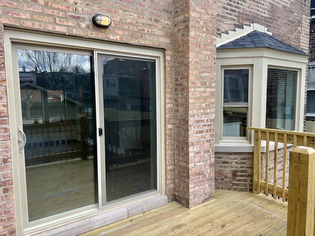 property entrance with a deck