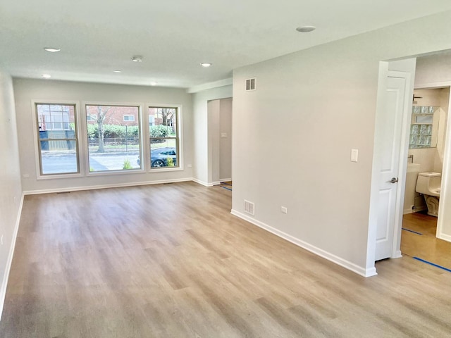 unfurnished room featuring light hardwood / wood-style flooring