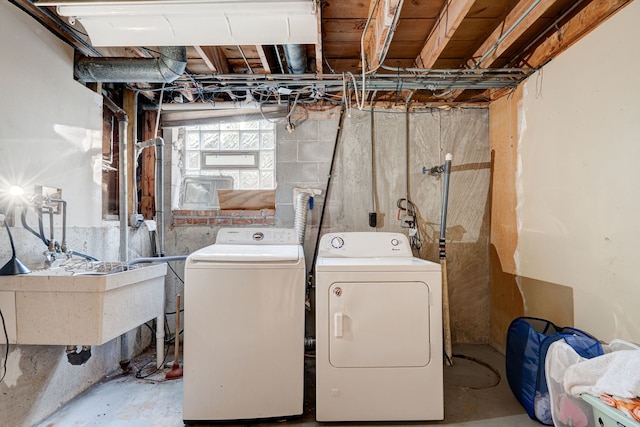 laundry room featuring sink and washing machine and clothes dryer