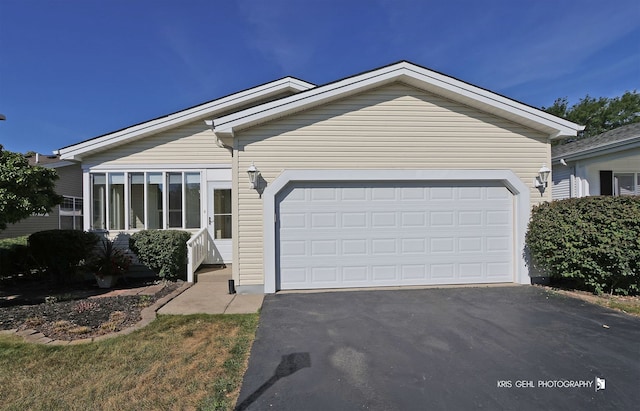 ranch-style home featuring a garage