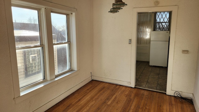 unfurnished room featuring hardwood / wood-style floors