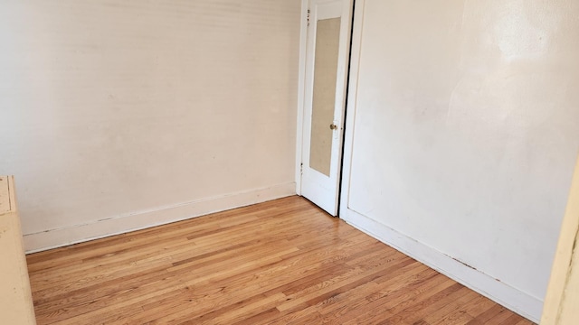 unfurnished room with light hardwood / wood-style floors