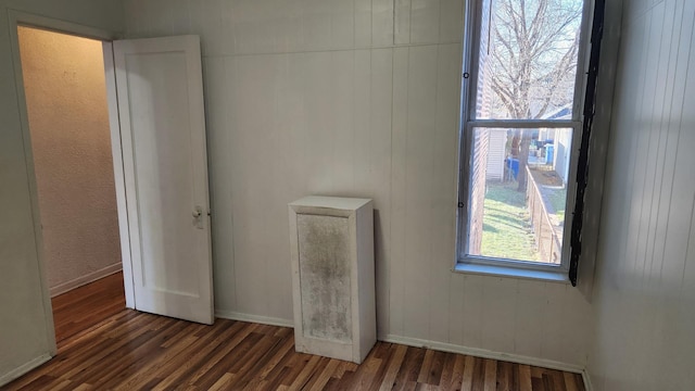 empty room featuring dark hardwood / wood-style floors