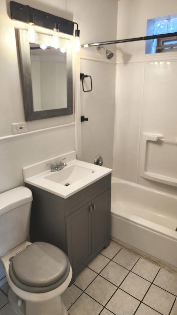 full bathroom with tile patterned flooring, vanity,  shower combination, and toilet