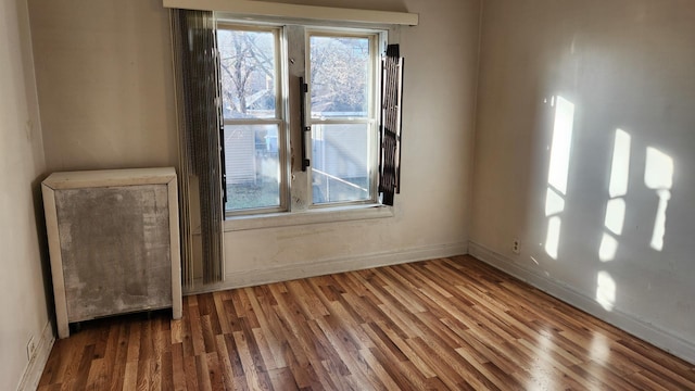 empty room featuring hardwood / wood-style flooring